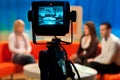 Shallow focus of a Video camera viewfinder, recording show in a TV studio during a talk show Royalty Free Stock Photo