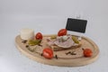 Wooden plate with charcuterie and french cheese Blank text space