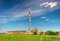 TV tower on green field