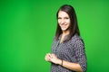 TV weather news reporter at work. News anchor presenting the world weather report. Television presenter recording in a green scree