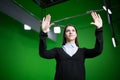 TV weather news reporter at work.News anchor presenting the world weather report.Television presenter recording in a green screen Royalty Free Stock Photo