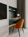 A TV and a working gray dressing table with an orange chair in the bedroom