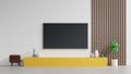 TV on Yellow cabinet or place object in modern living room with lamp,table,flower and plant on white wall background Royalty Free Stock Photo