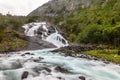 Tveitafossen waterfall powerful streams in Husedalen valley, Kinsarvik, municipality Ullensvang, Hordaland county, Norway Royalty Free Stock Photo