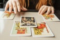 TVER, RUSSIA - FEBRUARY 11, 2023. Tarot cards, Tarot card divination, esoteric background. A woman makes a layout on the