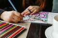 TVER, RUSSIA - FEBRUARY 11, 2023: a young woman draws neurography at a table at a psychological session, a neurographic