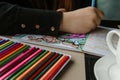 TVER, RUSSIA - FEBRUARY 11, 2023: a young woman draws neurography at a table at a psychological session, a neurographic