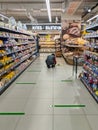 Social distancing tape lines across a supermarket floor