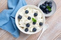 Tvorog, cottage cheese with blueberries in bowl