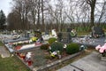 TVRDOMESTICE, SLOVAKIA - 12.3.2016: Graves, tombstones and crucifixes on traditional cemetery. Votive candles lantern and flowers