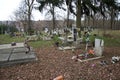 TVRDOMESTICE, SLOVAKIA - 12.3.2016: Graves, tombstones and crucifixes on traditional cemetery. Votive candles lantern and flowers