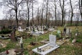 TVRDOMESTICE, SLOVAKIA - 12.3.2016: Graves, tombstones and crucifixes on traditional cemetery. Votive candles lantern and flowers