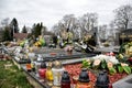 TVRDOMESTICE, SLOVAKIA - 12.3.2016: Graves, tombstones and crucifixes on traditional cemetery. Votive candles lantern and flowers