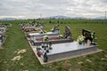 TVRDOMESTICE, SLOVAKIA - 12.3.2016: Graves, tombstones and crucifixes on traditional cemetery. Votive candles lantern and flowers