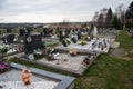 TVRDOMESTICE, SLOVAKIA - 12.3.2016: Graves, tombstones and crucifixes on traditional cemetery. Votive candles lantern and flowers