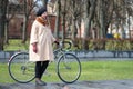 Tweed ride 2017. Unknown woman in ancient dress standing at the bike.