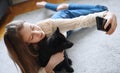 Tween girl with her new puppy doing selfie