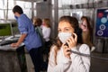 Tween girl in mask talking on telephone in quest room bunker Royalty Free Stock Photo