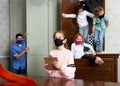 Tween girl in protective mask reading task in quest room Royalty Free Stock Photo