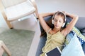 Tween girl relaxing on couch at home Royalty Free Stock Photo