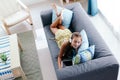 Tween girl relaxing on couch at home Royalty Free Stock Photo