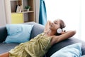 Tween girl relaxing on couch at home Royalty Free Stock Photo