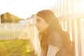 Tween kid girl profile in the park at sunset