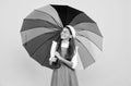 tween with vivid rain protection. happy school girl in glasses. teen child under colorful parasol Royalty Free Stock Photo