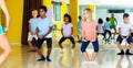 Tweens exercising with choreographer in class