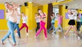 Tweens exercising with coach in choreography class Royalty Free Stock Photo