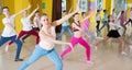 Tweens exercising with coach in choreography class Royalty Free Stock Photo