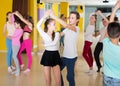 Tweens practicing vigorous dance in class Royalty Free Stock Photo