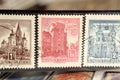 Tweezer holds postage stamp of Austria on Architecture