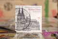 Tweezer holds postage stamp of Germany UNESCO World Heritage Cologne Cathedral