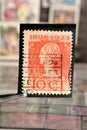 Tweezer holds postage stamp printed by Netherlands on topic Heads of State, Shows Queen Wilhelmina Reign jubilee
