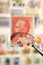 Tweezer holds postage stamp printed by Yugoslavia on topic Heads of State, Shows President Josip Broz Tito