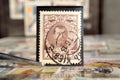 Tweezer holds postage stamp of Russia Nicholas the second