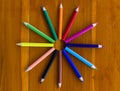 Twelve color pencils making the shape of a clock