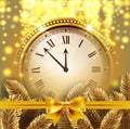 Twelve o`Clock on New Year`s Eve in colored gold glittered background with gold bow and fir tree branche. Royalty Free Stock Photo