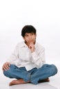 Twelve year old boy sitting, thinking Royalty Free Stock Photo