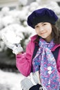 Twelve year old girl playing in the snow