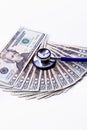 Twenties fanned out with a stethoscope. Royalty Free Stock Photo