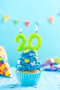 Twentieth 20th birthday cupcake with candle. Card mockup. Royalty Free Stock Photo
