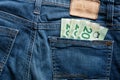 Twenty Canadian dollar CAD bills in the back pocket of a jeans Royalty Free Stock Photo