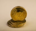 Twenty euro cent coins lie on a pile of coins. Coins on the blur Royalty Free Stock Photo