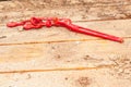 Twenty four inch, chain wrench, on wood platform, at a construction site