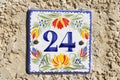 Twenty four street number on a wall Royalty Free Stock Photo