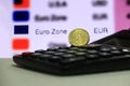 Twenty France euro cent on obverse with black calculator on white floor, digital board of currency exchange money background. Royalty Free Stock Photo