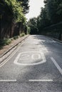 Twenty miles per hour speed limit sign on the road in Hampstead, London, UK. Royalty Free Stock Photo