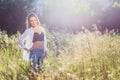 Twenty-year-old girl in jeans and white shirt in the box Royalty Free Stock Photo